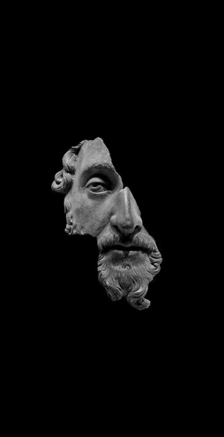 Fragment of a broken marble face